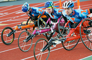 three University of Illinois wheelchair racers
